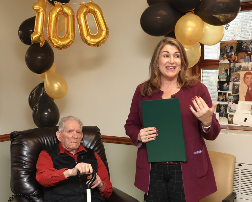 Sen. Rosemary Brown speaks to the partygoers while presenting 100-year-old Raymond “Ray” Naholnik a citation in recognition of his milestone birthday...