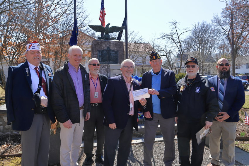 Pike County Commissioner Matt Osterberg presents a check from the American Recovery Account in the amount of $8,057 to James Mulligan, Commander of American Legion Post 139, following the Vietnam Veterans Day ceremony held in Milford, PA on March 29. Pictured are Gregory Protsko, Commander VFW Post  8612, left; Pike County Commissioners Ron Schmalzle, R. Anthony Waldron III and Osterberg; Mulligan; John Kupillas, Chaplain, American Legion Post 139; and Jesiah Schrader, Director, Pike County Veterans Affairs...