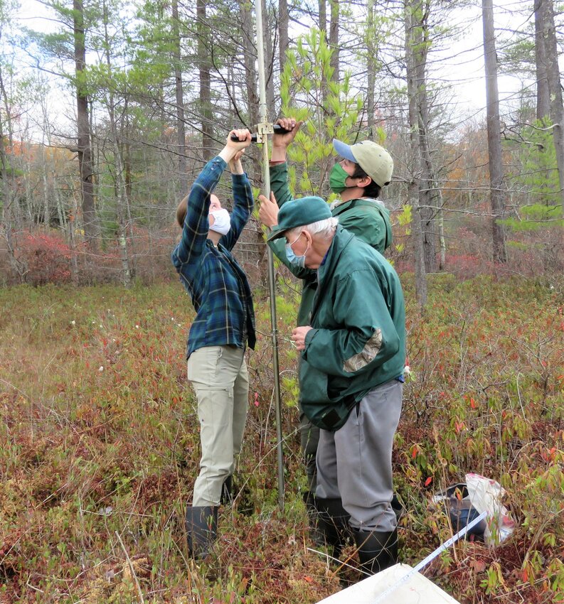 Peat bogs are endlessly fascinating. Learn more at a two-part talk on Sunday, May 21. Pictured are people coring a peat bog at Flying Trillium Gardens & Preserve.