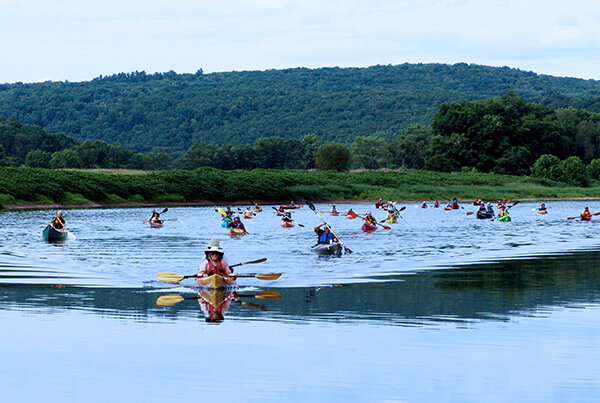 Sojourners paddle in the Upper Delaware River.