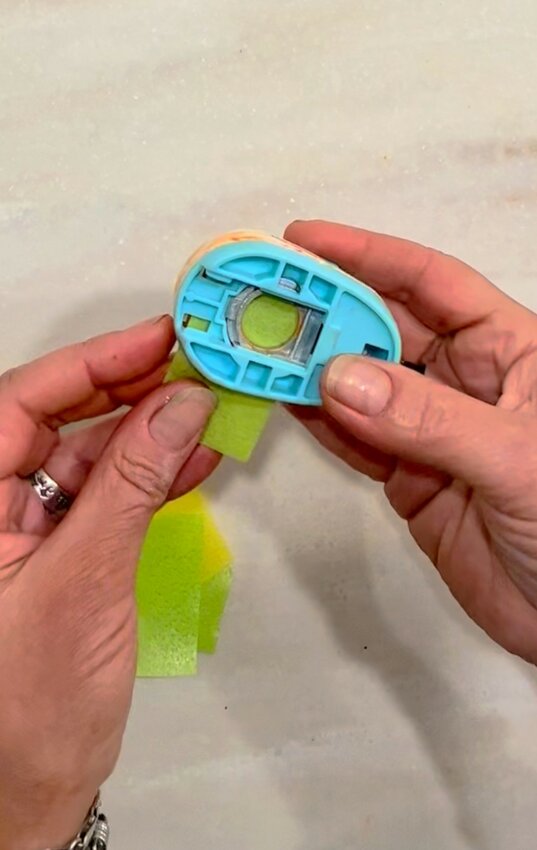 Using a paper punch, create little circles of various colors out of wafer paper.