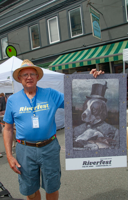 DVAA volunteer Jim Lomax strolled Riverfest last weekend, prior to the highly anticipated annual poster auction.