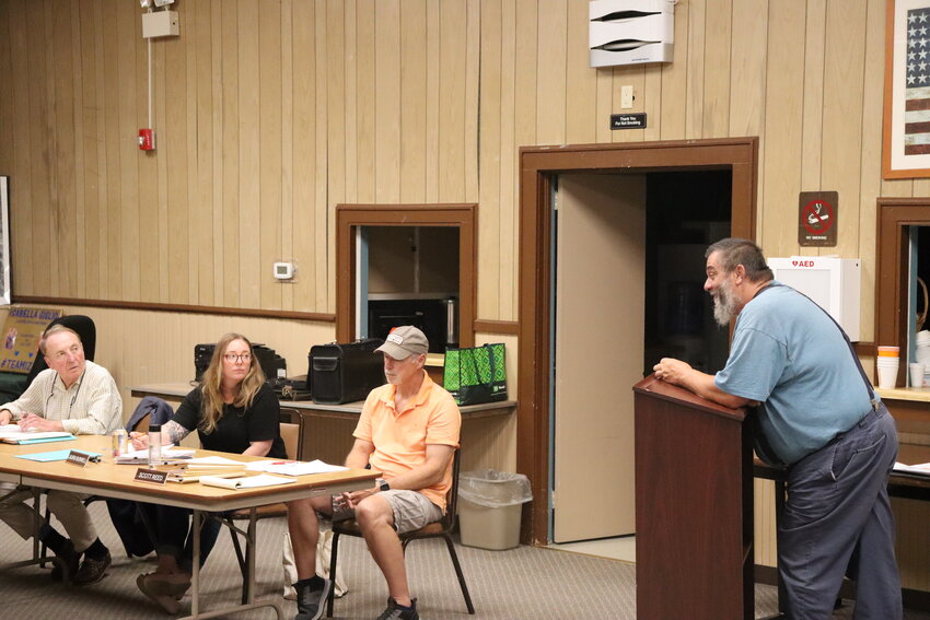 Town of Highland attorney Michael Davidoff, left, and planning board alternate members Laura Burrell and Scott Reed listen to a presentation from Mark Rossi at a Wednesday, July 26 meeting of the Town of Highland planning board.