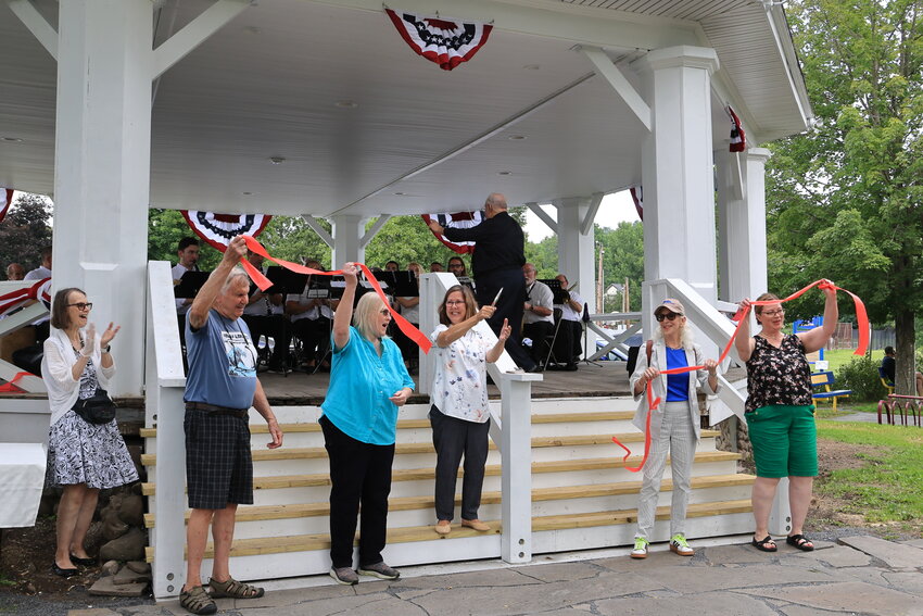 The Ellingsen Bandstand ribbon-cutting ceremony. Pictured are Diana Billard, granddaughter of Christopher Ellingsen, left; Dick Briden, Hawley Parks & Recreation member; Elaine Herzog, Hawley Borough Council and Parks & Recreation member; Jocelyn Cramer, Wayne County Commissioner; Nancy Swartz, senior project coordinator/assistant to the president, Reilly Associates; and Michele Rojas, president of the Hawley Borough Council and Ellingsen’s great-granddaughter...