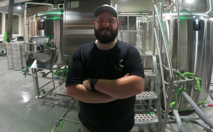 The scientist in his laboratory, Charles Mills has moved to Honesdale from New Jersey to join Runaway Train as head brewer.