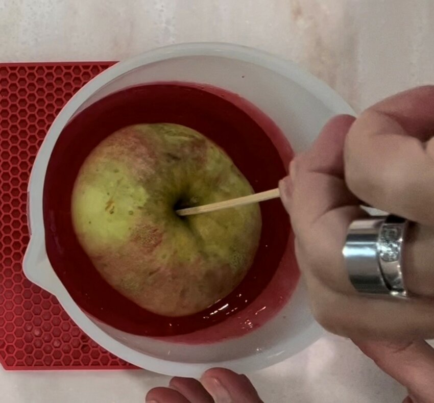 Dip apples into melted candy. Remove the excess and let harden...