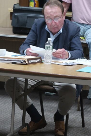 Town attorney Michael Davidoff reads the prepared resolution that lays out reasoning for a negative declaration. In a surprise split 3-2 vote, the board voted to issue a positive declaration which triggers the SEQR review.