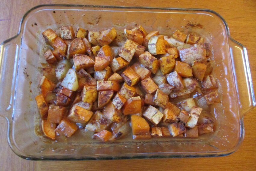 Baked sweet potatoes and pear with maple syrup and cream