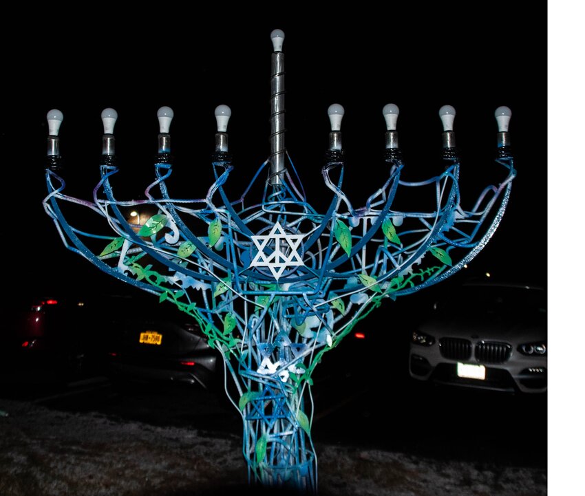 The new Landfield Avenue Synagogue menorah, designed by Zac and Barry Shavrick, was lighted for Hanukkah this year. Zac’s metal works can be seen in many public places around Sullivan County. And Barry made his first menorah 45 years ago. “I like to think my menorahs are a new take on the fragility and delicacy of traditional Judaica,” Barry said. “Each one is different, but all reflect the symbol of the original, with a twist.”