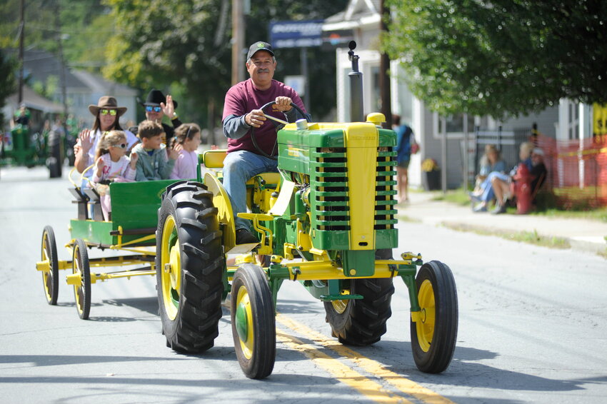 George Varsam rides his 1948 John Deere, one of many restored tractors at Jammin’ in Jeff.