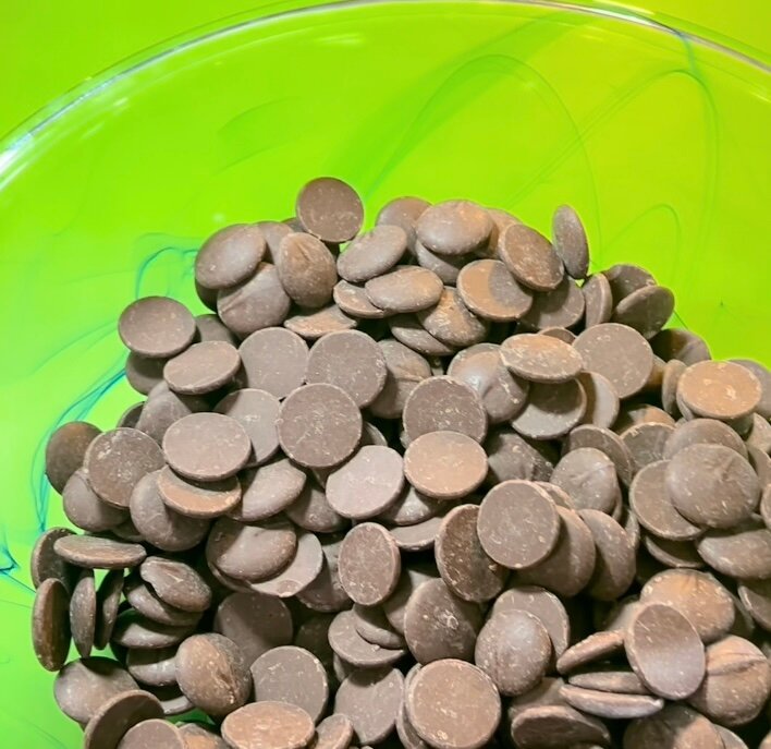 Temper chocolate wafers: Microwave for 30 seconds, then in 15-second intervals until chocolate reaches about 113 degrees F. Temper with more chocolate wafers until temperature comes down to about 88 degrees. Stir...