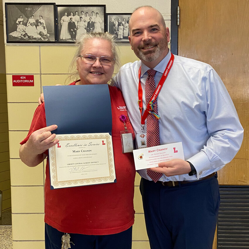 Mary Chanov, left, was recognized by the Liberty Central School District with an Excellence in Service award. She is pictured with Liberty superintendent Dr. Patrick Sullivan.