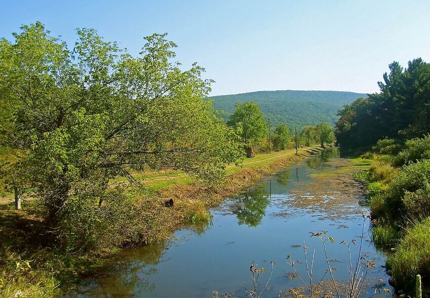 A remaining section of the Delaware and Hudson Canal off US 209 near Summitville, NY, that Sullivan County has declared a linear park. The Shawangunk Ridge is visible in the rear. This file is licensed under the Creative Commons Attribution-Share Alike 3.0 Unported license.