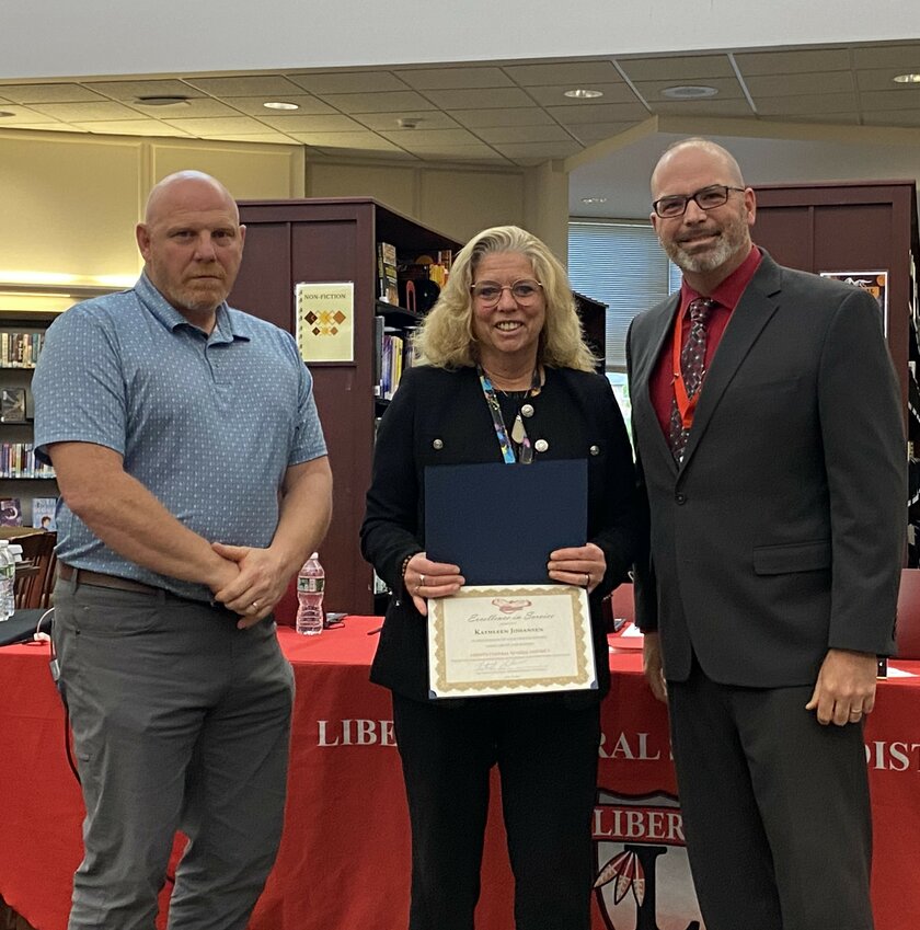 Kath Johansen is pictured in the center. She is flanked by Liberty Central School District board president Matthew DeWitt and superintendent Dr. Patrick Sullivan.
