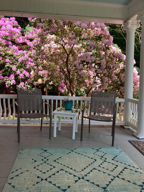 An indoor/outdoor area rug can add a nice touch of color and pattern to a porch, adding to the  ambiance of outdoor living.