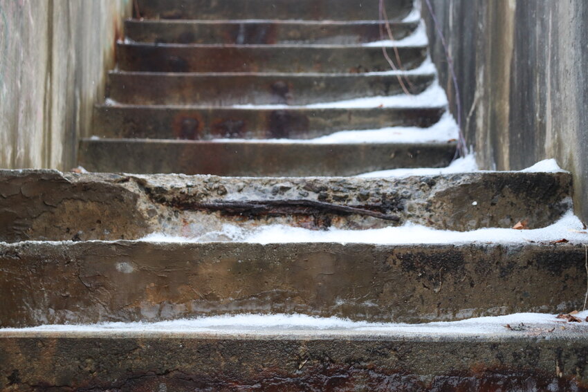A close up of damage to the Cliff Street stairs.
