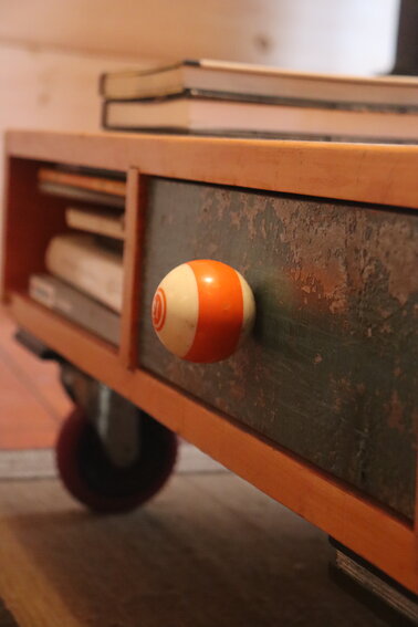Roth has repurposed plenty of strange objects as furniture details—like this pool ball, repurposed for use as the pull of a living room table drawer…
