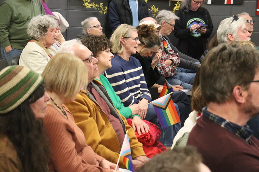 Audience members listen during an April 16 meeting of the Delaware Valley School Board.