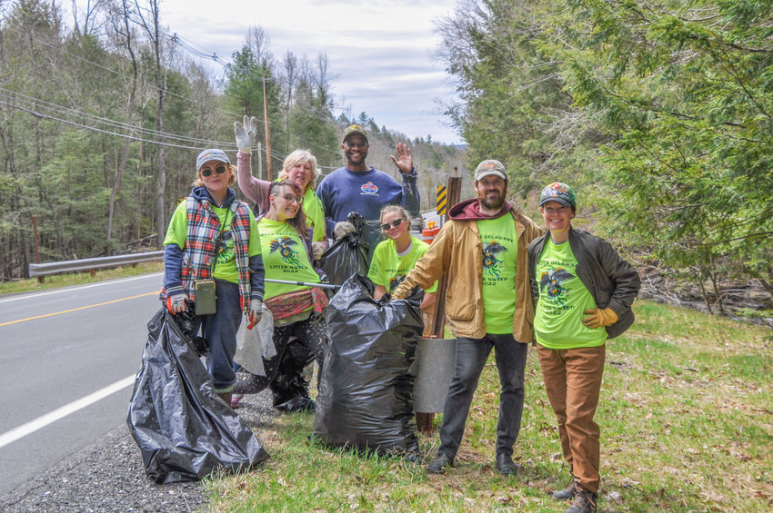A past Delaware River region litter sweep event with a group of volunteers plucking trash off the road on Route 55 between Eldred and Barryville.