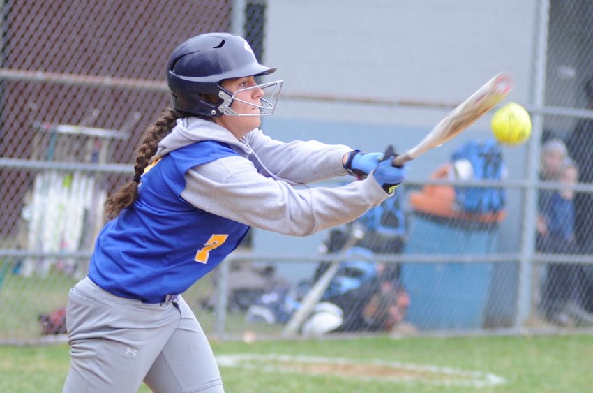 Chapel Field&rsquo;s Heather Schoch connects on a Riley Ernst pitch.