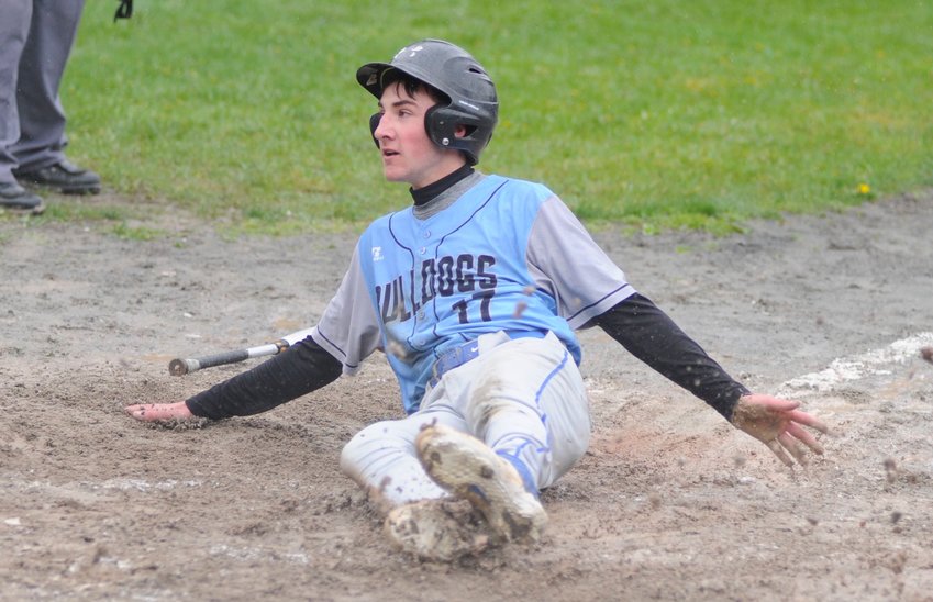 Solo score. In the third inning, Sullivan West&rsquo;s Andrew Hubert slides home for the Bulldog&rsquo;s only score in the game.