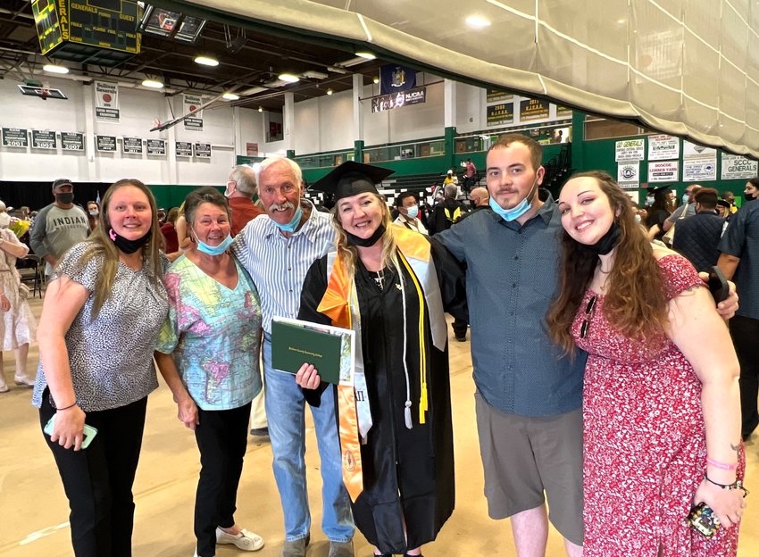Amy Brudermann with her family at her graduation.