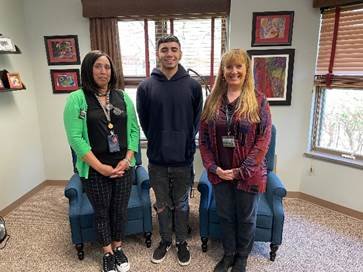 New Hope celebrates the first employee to get a GED through its Associate Direct Support Professional program. Pictured are day program coordinator Melissa Martinez, left; Joel Salas, GED graduate and direct support professional, and Debra McGinness, CEO.