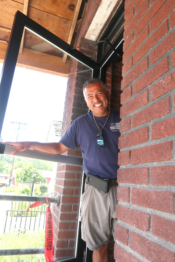 Nick Santana stands in one of the newly installed doorways that will lead to the Narrowsburg Shops &amp; Market,  a multi-space commercial building, on Main Street.