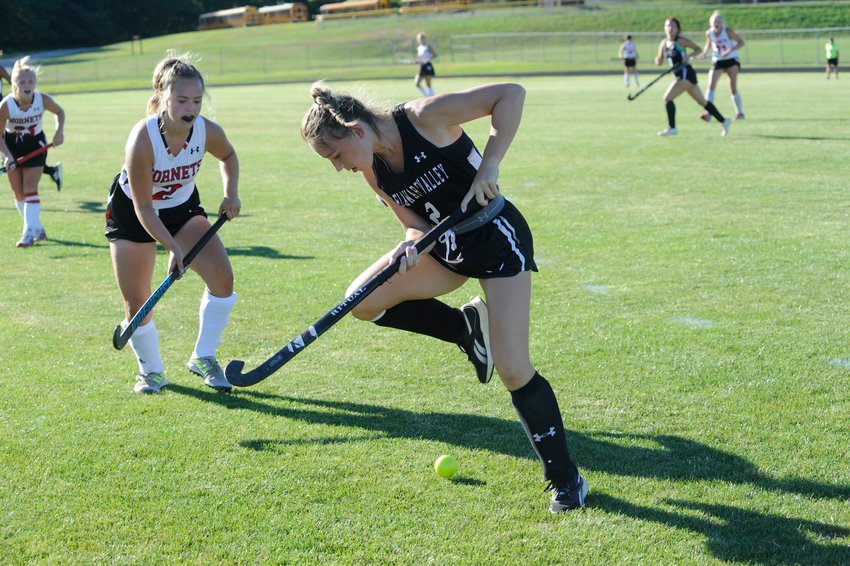 Hot-footin&rsquo; field hockey. Delaware Valley&rsquo;s Ava O&rsquo;Grady shows off a few improvised dance moves on the green as Honesdale&rsquo;s Jillian Hoey closes in on the play...