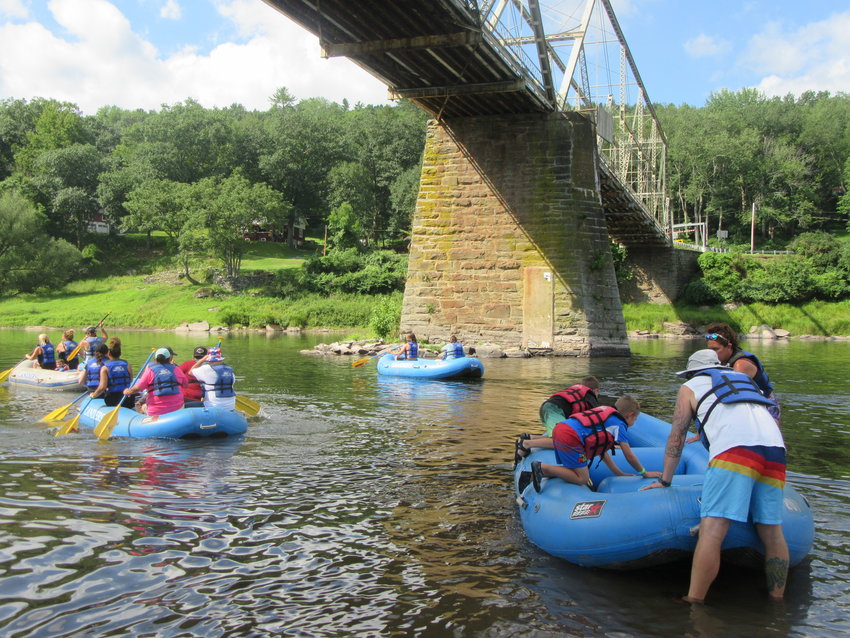 Participants in the Upper Delaware Council&rsquo;s 34th annual family raft trip launch beneath the Skinners Falls-Milanville Bridge for their August 7 paddle to Lander&rsquo;s Narrowsburg base.