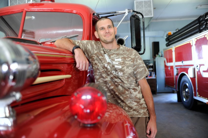 Jesse Campfield, Lava Fire Department&rsquo;s 28-year old chief, joined the all-volunteer department as a 17-year-old in 2011. He is pictured with the department&rsquo;s 1947 Ford engine apparatus.