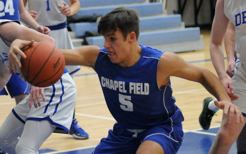 Gotcha! Chapel Field&rsquo;s Bryce Hollo reels it in on the paint.