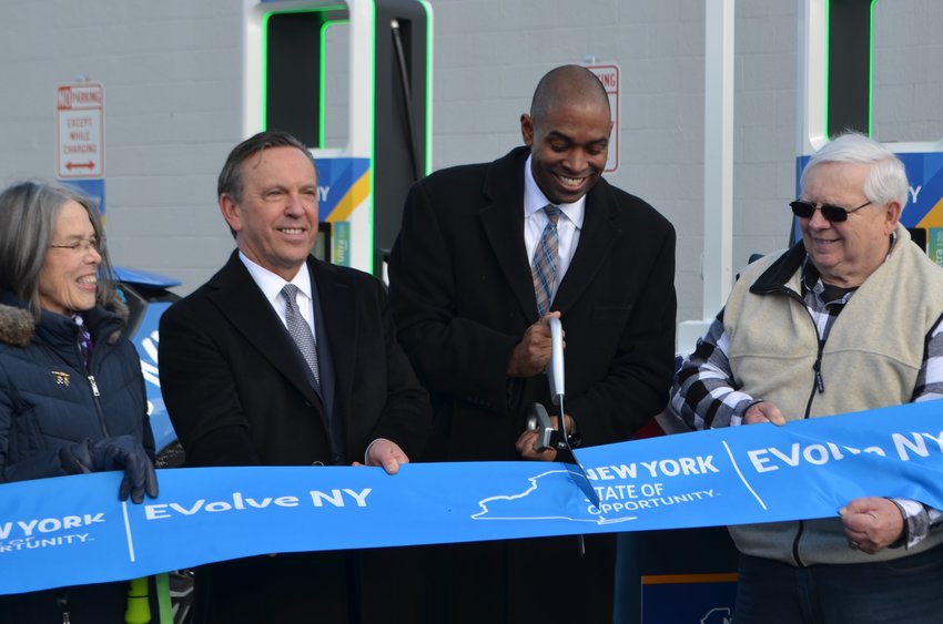 Geraldine Walsh, left, a member of the Hancock Hounds Dog Park; Justin Driscoll, NYPA Acting President and CEO; Lieutennant Governor Antonio Delgado; and Town of Hancock Supervisor Jerry Vernold cut the ribbon on a new EVolve NY electric vehicle charging hub in Hancock.