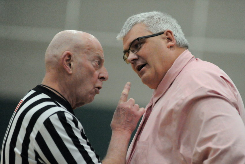 Now hear this. Veteran ref Mike Bernstein makes his point emphatically to Eldred&rsquo;s coach Bill Furler on a disputed call from the court.