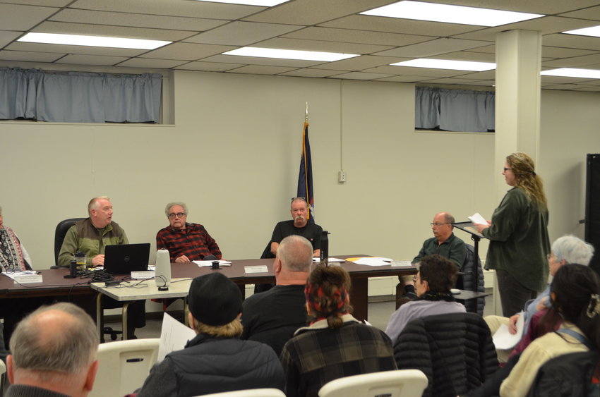 Supervisor Ben Johnson (seated) addressed the issue in comments at the start of the February 14 town board meeting. The Beaver Brook residents who spoke at the meeting (including Jaye Nydick, standing) expressed frustration at a lack of responsiveness from the planning board.