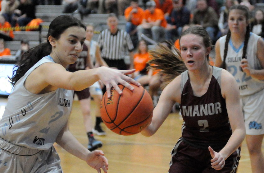Hands on hoops. Sullivan West&rsquo;s Viola Shami and Manor&rsquo;s Mackenzie Carlson.