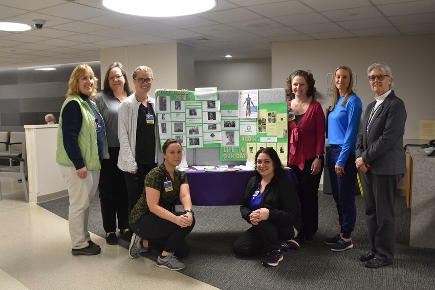Creating hope and optimism with occupational therapy. Pictured, standing, are Kathleen Neenan, left; Linda Moore; Jacqueline Gallik; Kimberly Emick; Jessica O&rsquo;Neill; and Terri Henderson. Pictured, kneeling are Kristen Ost, left, and Alyssa Tyler. Missing from photo are Sean Phillips, Karen Stumpo and Kristen Krayer...
