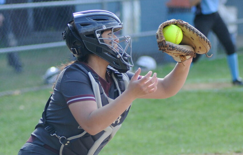 Special delivery. Manor&rsquo;s catcher, Jocelyn Mills, reels in Carlson&rsquo;s pitch.