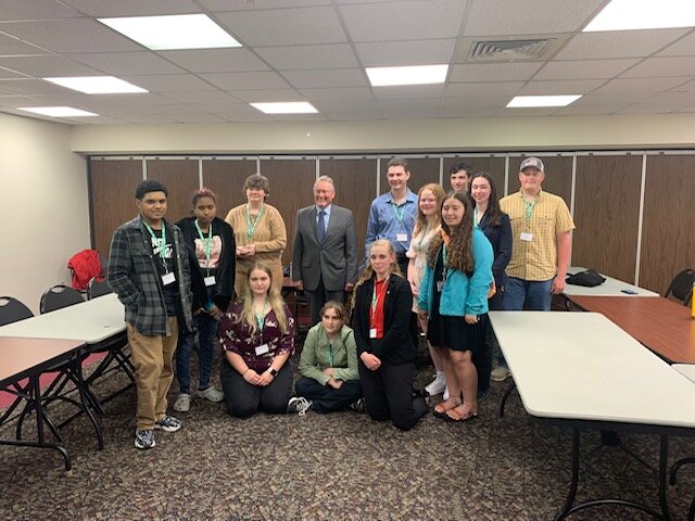 The delegates were photographed with the Commissioner  of Agriculture Richard Ball (standing, center) after discussing with him the issues facing the viability and growth of agriculture in New York State.