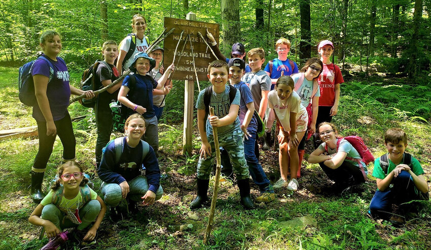 Kids hike on the Blair Hill Trail as part of the Lackawanna College Environmental Education Center&rsquo;s summer camp.....