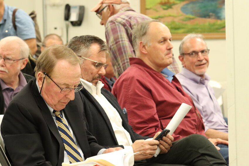 Michael Davidoff, left, attorney for Bar Veloce; Frederick Twomey, owner of Bar Veloce; Brendan Weiden, co-owner of the Narrowsburg Union; and Ben Gailey, attorney for the Narrowsburg Union, prepare for a Monday, June 12 meeting of the zoning board of appeals.