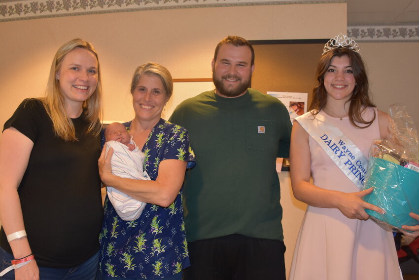 Welcoming newborn Hadley Jo Owen, the first baby born in Dairy Month. Pictured are mom Lindsey, RN Mary Jeanne Joyal holding Hadley Jo, dad Gaston and Sydney Roberts.