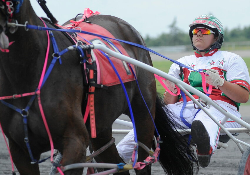 Marianna Monaco is a triple threat in harness racing as an owner, driver and trainer, She is pictured &ldquo;on the bike&rdquo; at a recent race at the Mighty M.