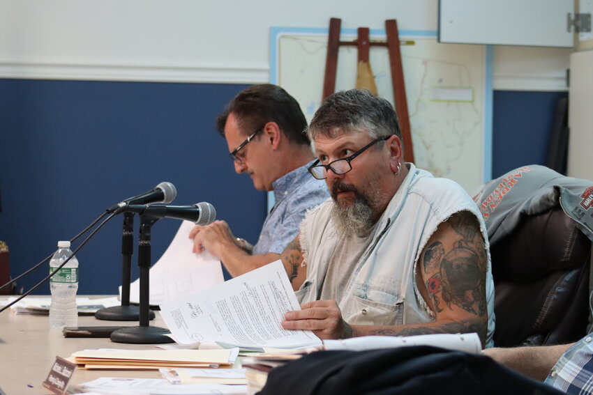Town of Bethel planning board members Daniel Gettel, left, and Jim Crowley discussing the White Lake Estates development project at a Monday, August 7 meeting.