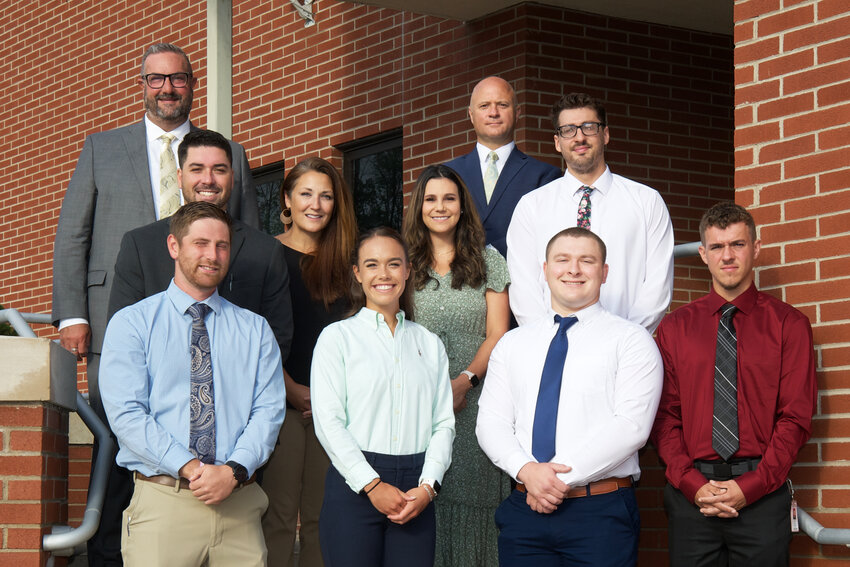 New teachers&mdash;bottom row, Adam Kelly, left, Lauren Cawley, Alec Dragos, Jason Reed; middle row, Ryan Keen, Anna Avery, Kylie Watson, Kade Kolhetter; and top row, Timothy Morgan,  and assistant superintendent Greg Frigoletto&mdash;participated in a new teacher orientation and mentoring session.
