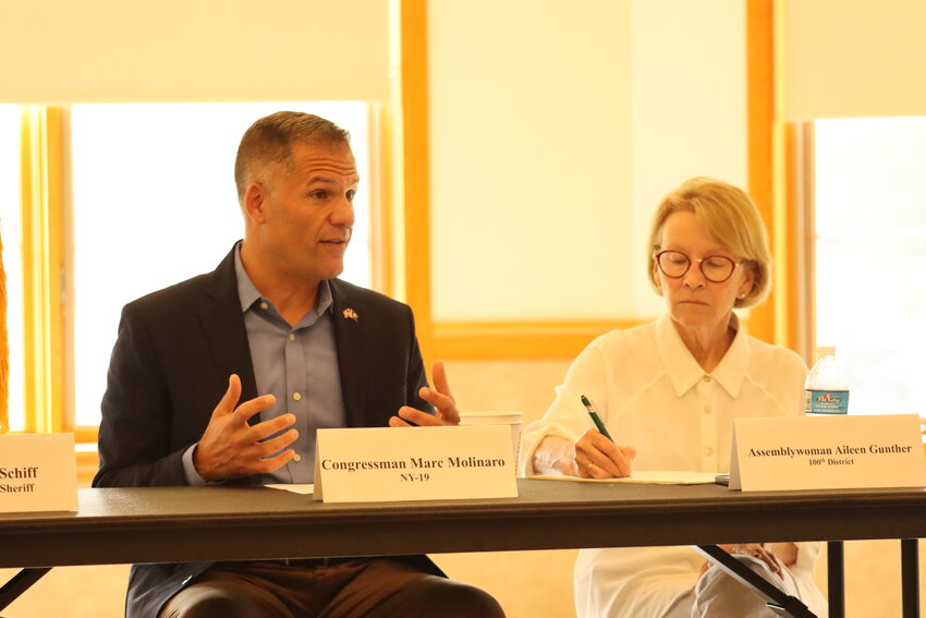 Representative Marc Molinaro, left, hosts a roundtable to discuss opioid crisis solutions last September.
