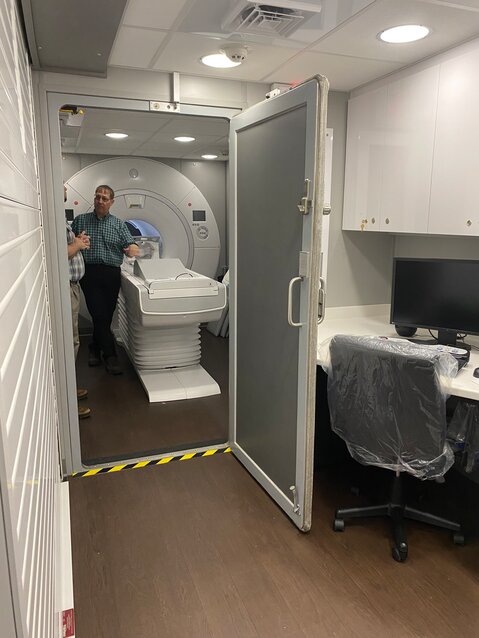 Marc Arnold, Delaware Valley Hospital facilities manager and engineer, near an MRI scanner.