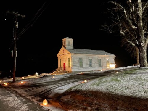 Luminaria light the way to the Damascus Manor UM Church.