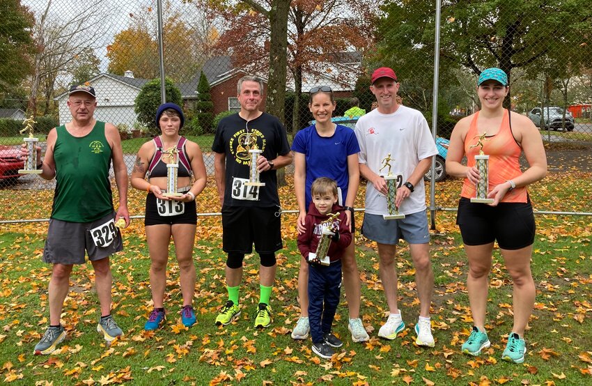 The Milford Lions Club 5K run/walk took place in October. Pictured are Martin Nowak (third place M), left; Krista Van Horn (third place F); Mike O'Keefe (second place M); Audrey Dennis (second place F); Garry Dennis (first place M); and Stephanie Fort (first place F).