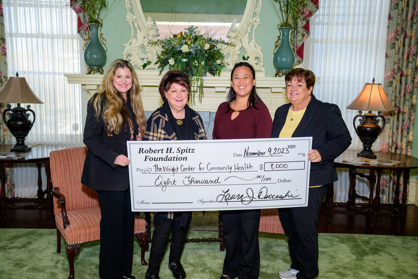 The Wright Center for Community Health received an $8,000 grant from the Robert H. Spitz Foundation in support of the Wright Center for Patient and Community Engagement. The grant will help provide a food donation program, bus passes and transportation assistance to and from doctor appointments. Pictured are Laura Ducceschi, left; Mary Marrara; Holly Przasnyski; and Cathy Fitzpatrick...